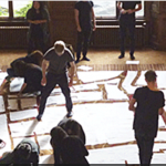 LaTD 2015 People assembling paper puzzle pieces on the floor of a conference room