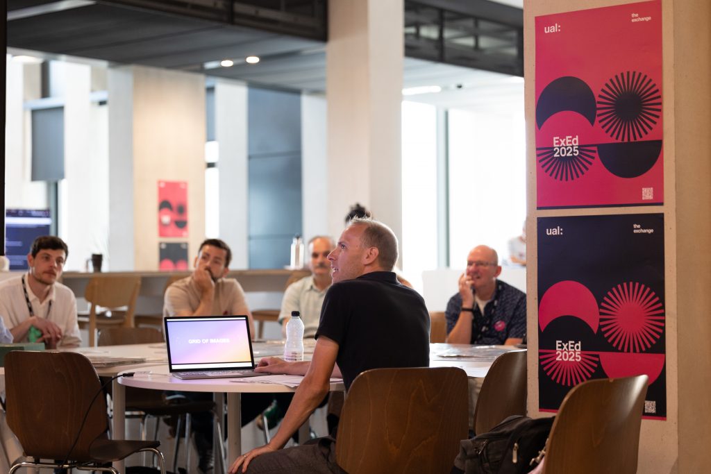workshop session with people sat around tables with laptops