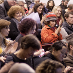 Conference attendees sitting in a lecture theatre